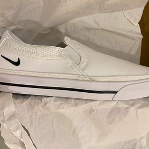 WMNs Nike Court Legacy Slip.  New but elastic side panel has one pull